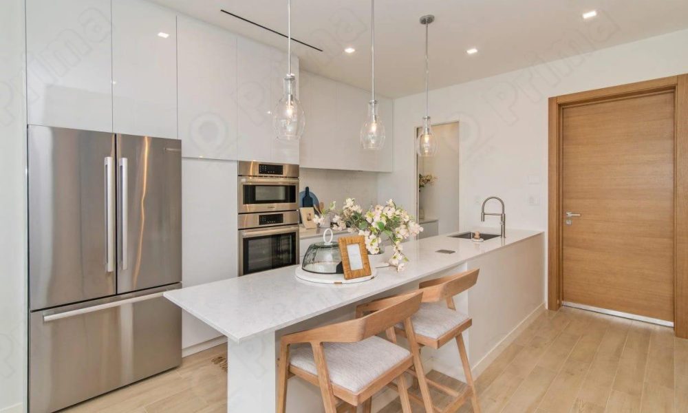 Modern white multifamily kitchen with island – HY Global cabinetry project in Los Angeles
