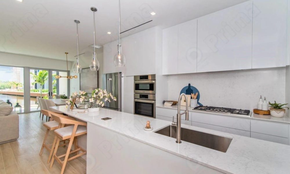 Contemporary multifamily kitchen cabinets in Los Angeles with soft-close white cabinets by HY Global